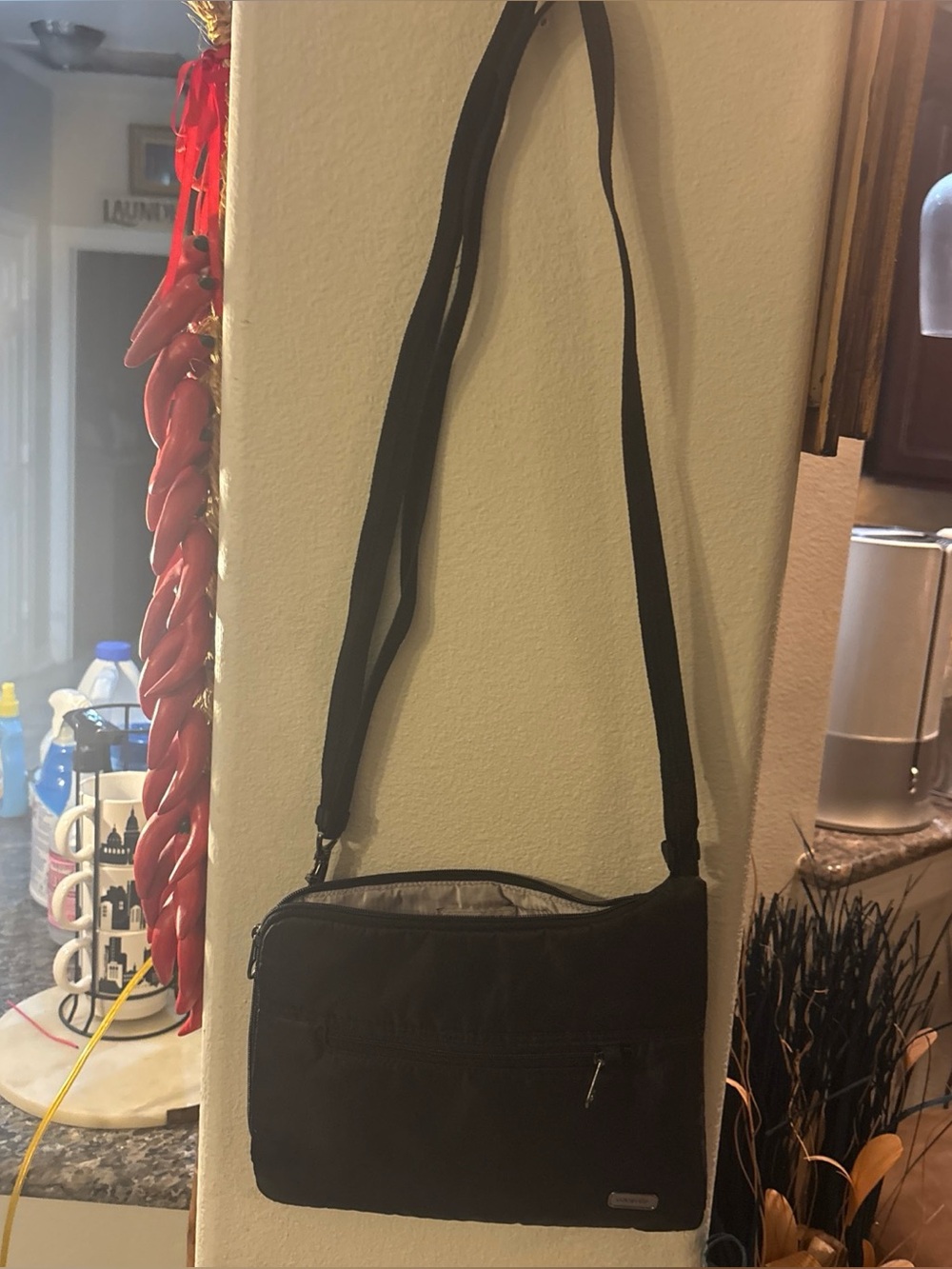 black Pacsafe Daysafe anti-theft slim crossbody